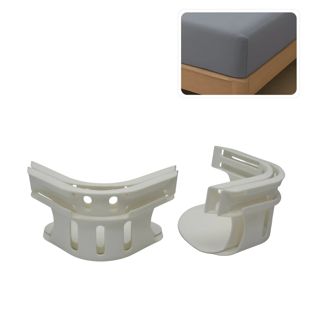White plastic bed sheet holders with close-up of fitted sheet on mattress corner